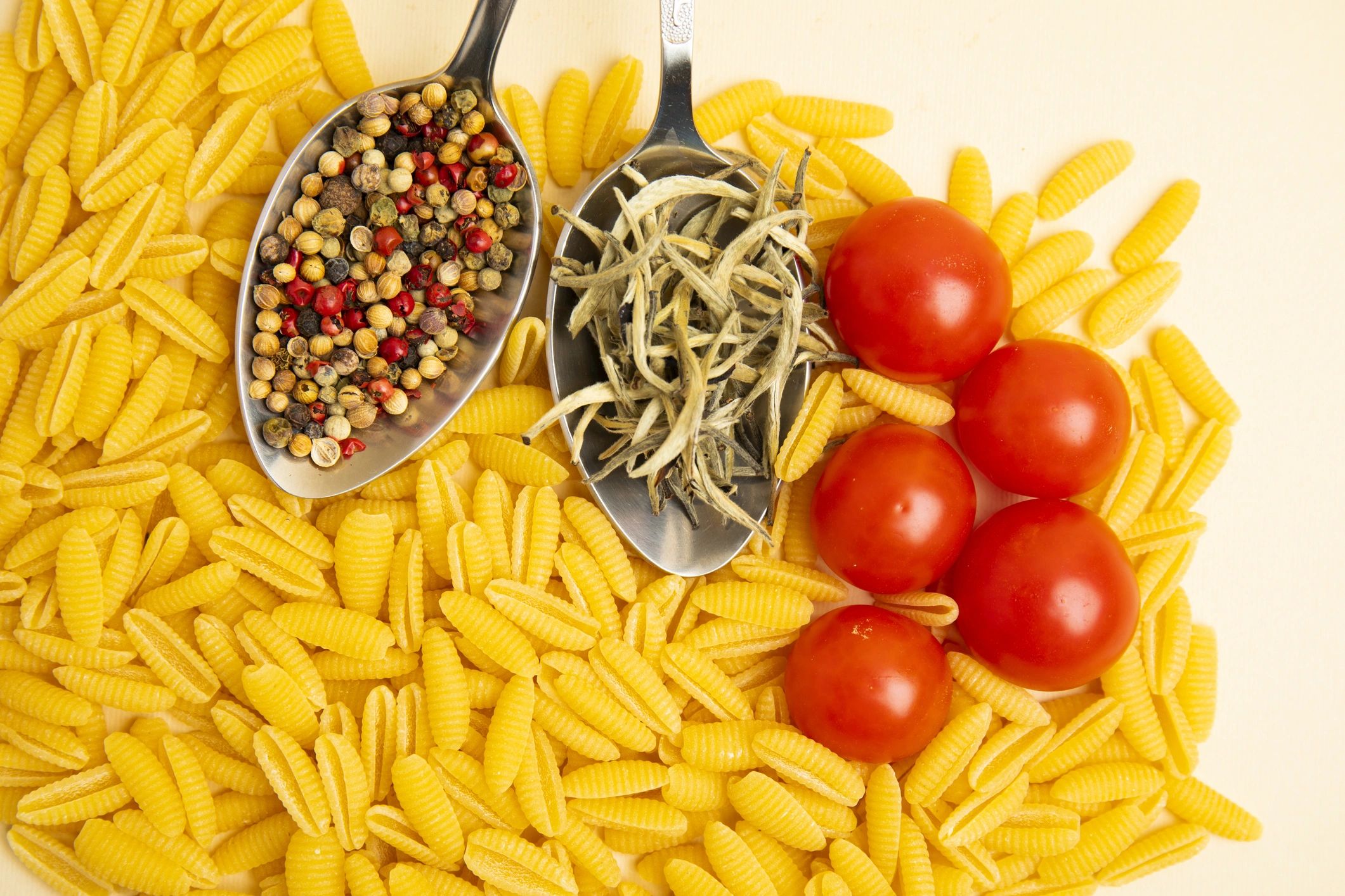 Italian ingredients flat lay with pasta and tomatoes